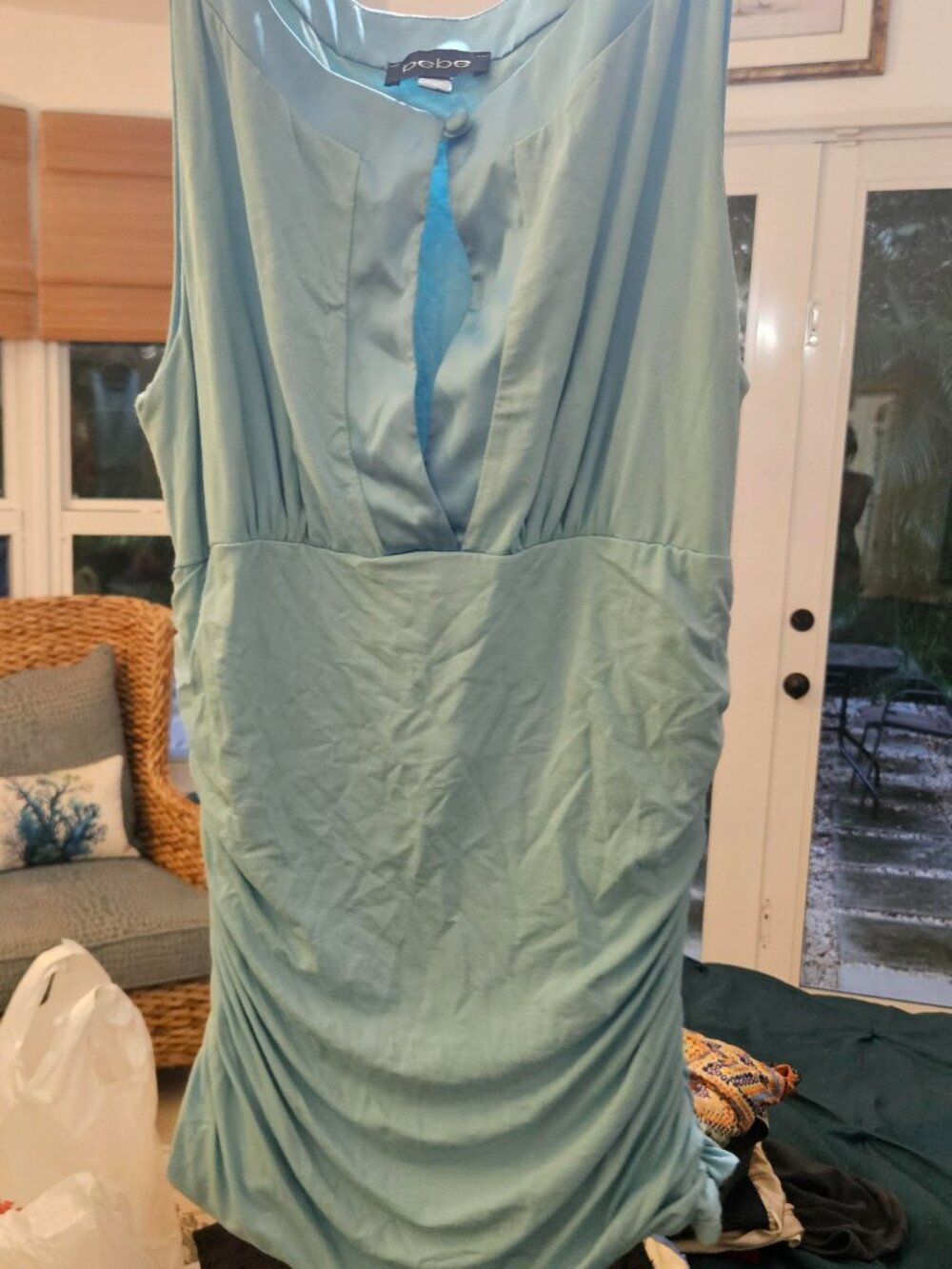 BEBE BEAUTIFUL BABY BLUE TOP WITH SATIN DETAILS AND PEEPHOLE